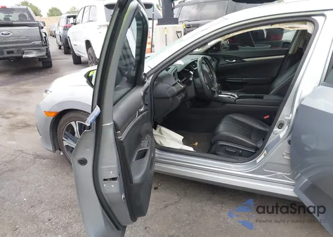 2017 Honda Civic Touring z USA, uszkodzony, nr VIN 2HGFC1F9XHH634745